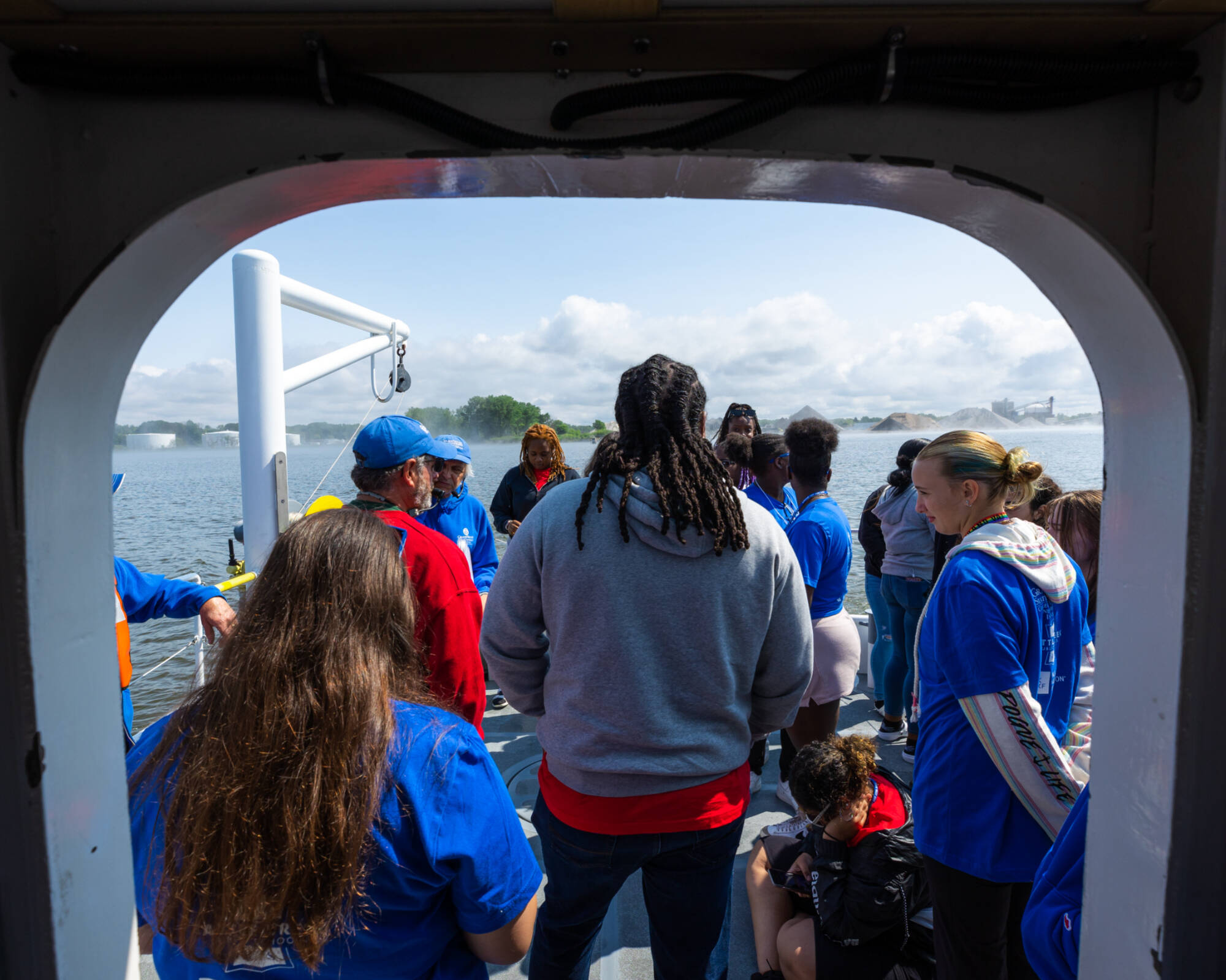 View of students and instructors gathered on the back deck of the D.J. Angus from the lab